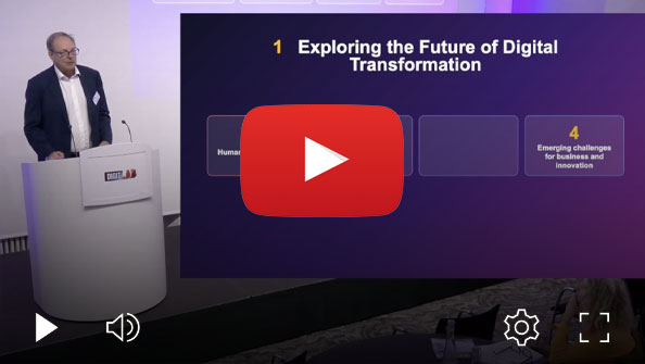 Person presenting at a DIGIT Lab podium beside a large presentation slide titled “Exploring the Future of Digital Transformation”, displayed within a video player interface.